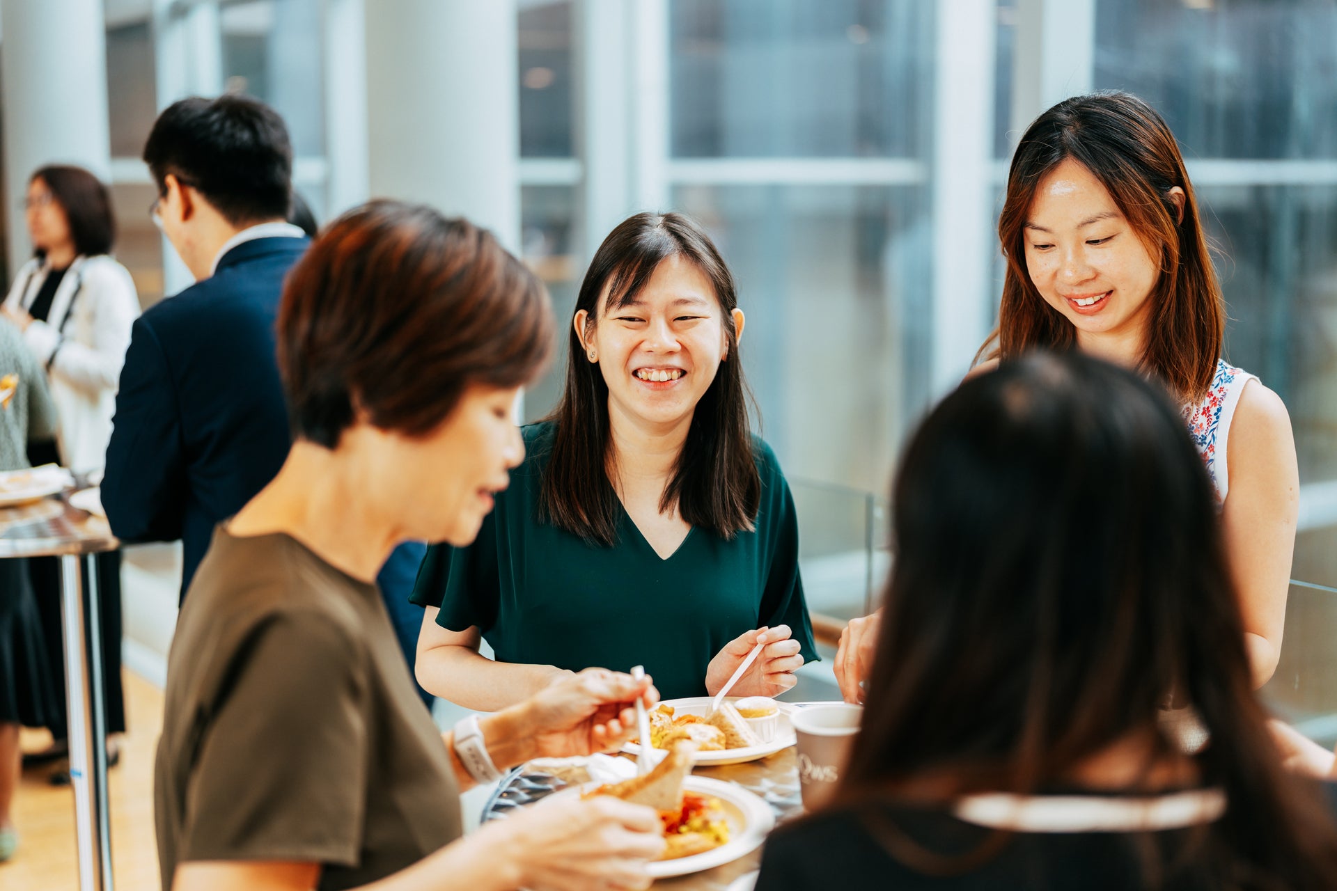 NUS Immersion Programme participants interacting with colleagues from the NUS hosting departments during the breakfast reception at University Hall Linkbridge