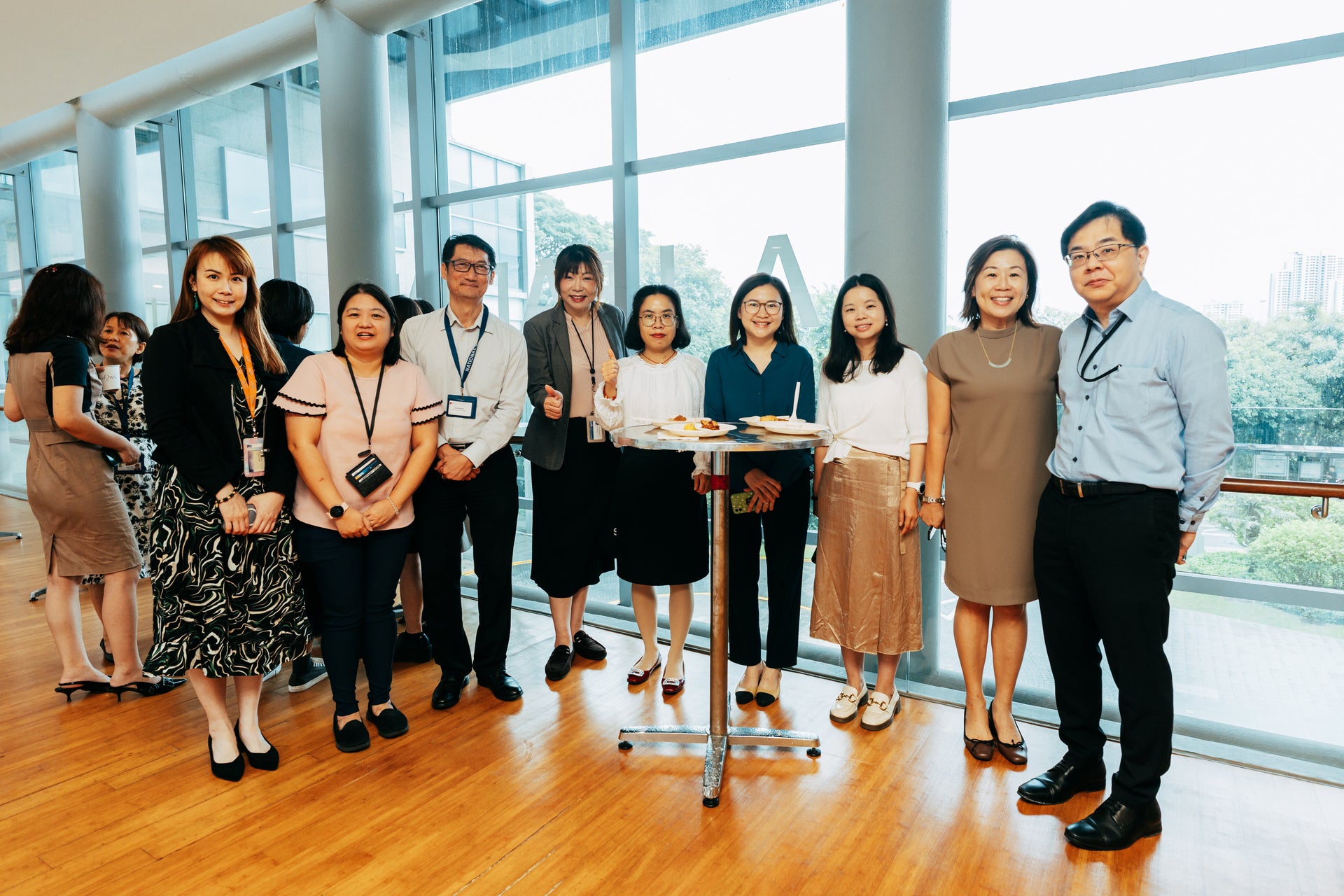 NUS Immersion Programme participants interacting with colleagues from the NUS hosting departments during the breakfast reception at University Hall Linkbridge